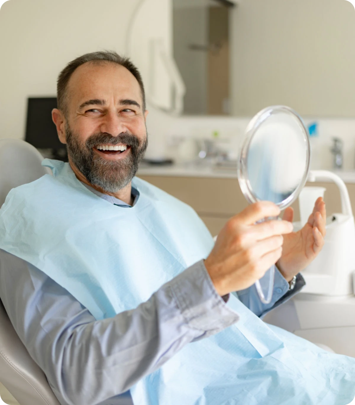 Happy man at dentist's office