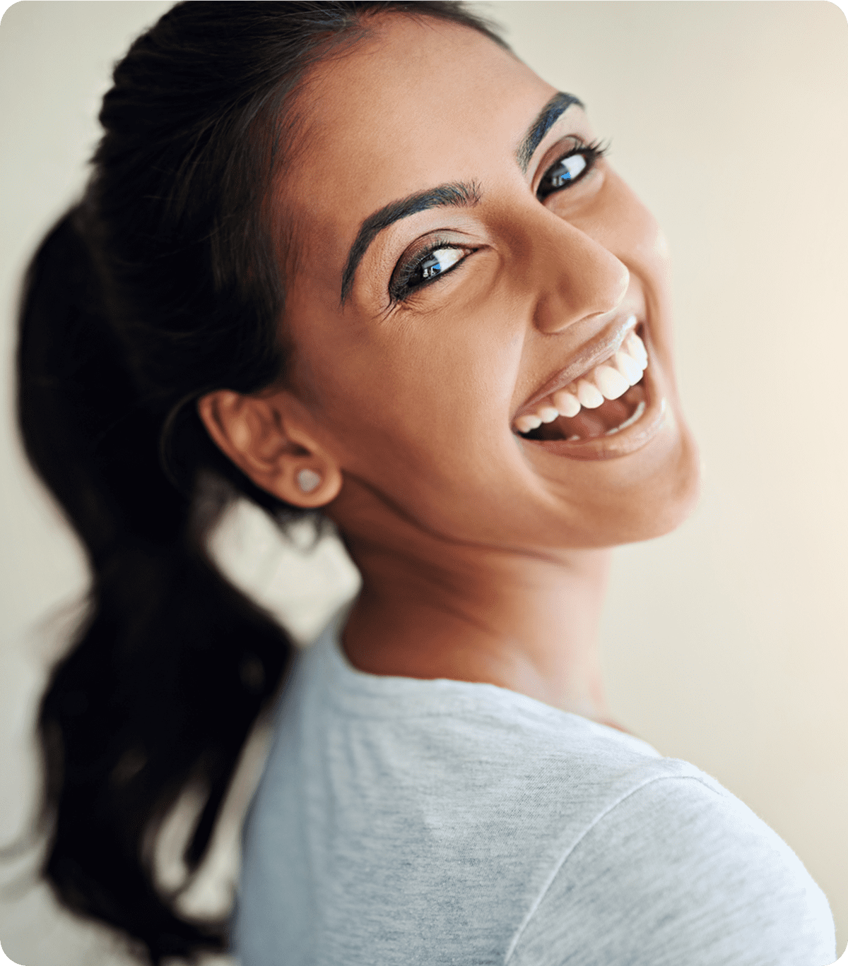 Happy woman turning and smiling brightly